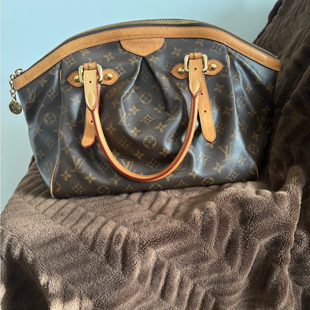 Authentic Louis Vuitton Tivoli Monogram GM Tote bag.
